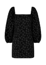 Short dress in black with all-over floral structure. AtiraMD dress has long balloon sleeves and a more fitted body. The neckline is square in front and back.