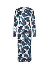 Form-fitting dress with long sleeves and round neck. AustinMD print dress has a decorative vertical stich in front and back.