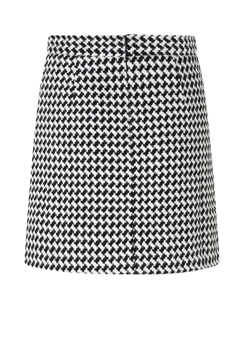 Short, A-shaped skirt with medium-height waist and a hidden zipper at back. BadiaMD skirt has a structure, woven quality with line. The skirt is a part of a suit. Shop the jacket here: BadiaMD jacket