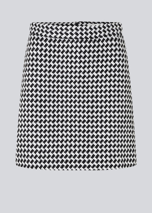 Short, A-shaped skirt with medium-height waist and a hidden zipper at back. BadiaMD skirt has a structure, woven quality with line. The skirt is a part of a suit. Shop the jacket here: BadiaMD jacket.