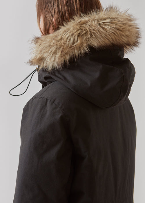 Technical jacket with natural down filling. The BaseMD jacket has adjustable hood with fauw fur piping and big pocket in front and piped pockets by the chest. The style has long sleeves with ribbed cuffs. 