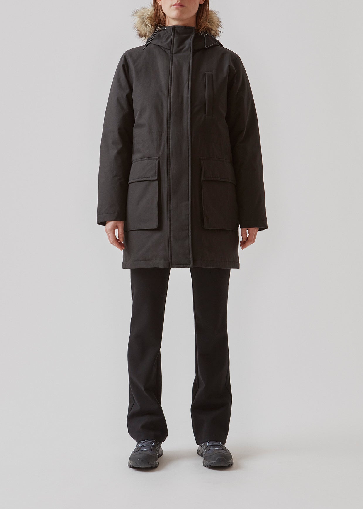 Technical jacket with natural down filling. The BaseMD jacket has adjustable hood with fauw fur piping and big pocket in front and piped pockets by the chest. The style has long sleeves with ribbed cuffs. 