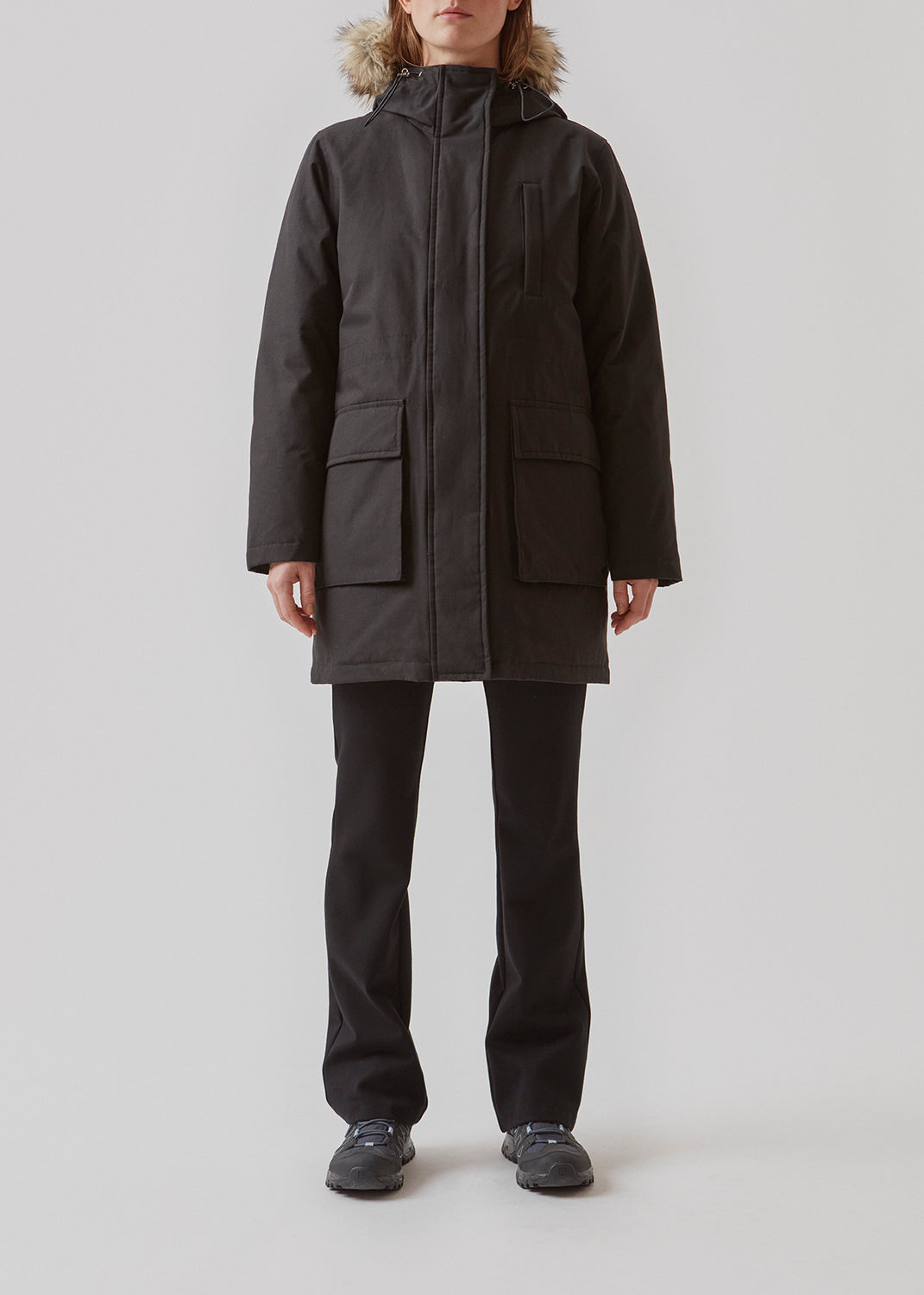 Technical jacket with natural down filling. The BaseMD jacket has adjustable hood with fauw fur piping and big pocket in front and piped pockets by the chest. The style has long sleeves with ribbed cuffs. 