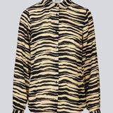 Shirt made from recycled materials. BeckyMD print shirt offers a relaxed fit with wide sleeves with cuff, shirt collar, and button closure in fro
