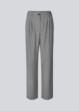 High-waisted pants with pleats and long, wide legs. BennyMD pants have zip fly and button, belt loops, discreet side pockets, and decorative paspoil pockets on the back. The model is 176 cm and wears a size S/36