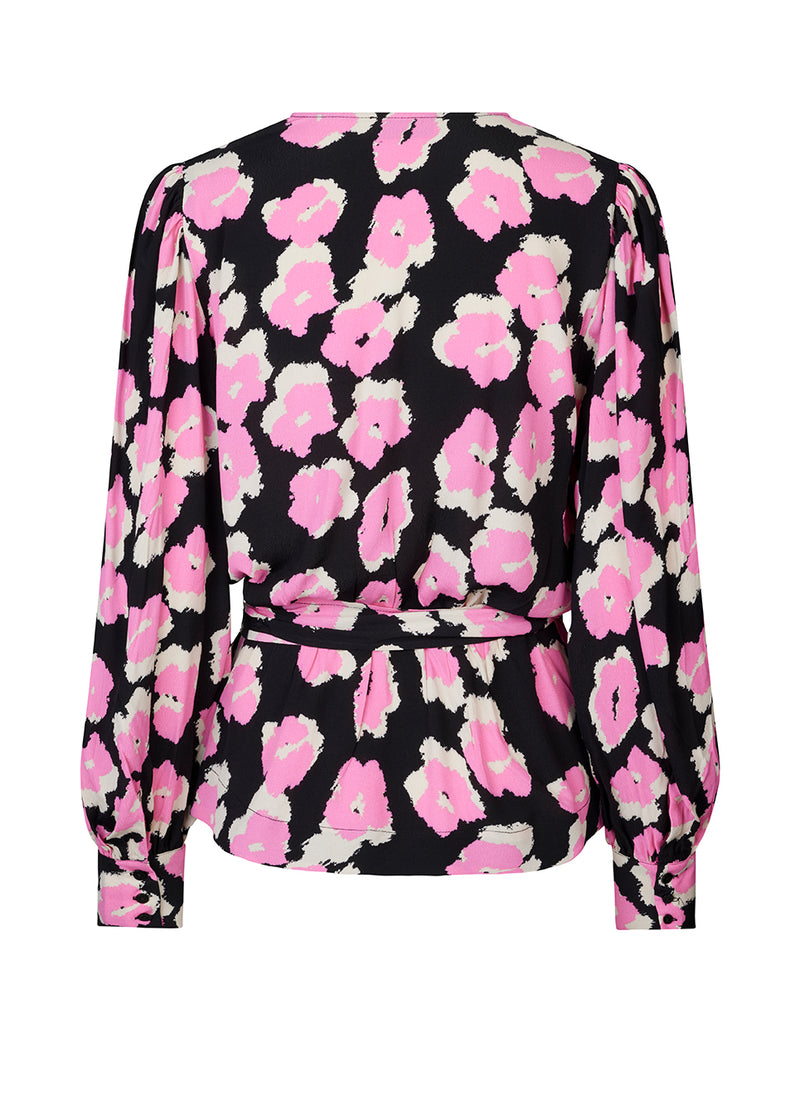 Wrap top designed with a v-neckline in front and a wide belt at the waist. BibbieMD print top has long balloon sleeves with cuff. The floral material is a more responsible quality.