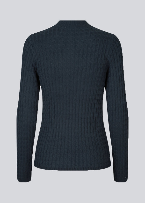 Cable-knitted jumper in dark blue with a figure-hugging silhouette. BimoMD t-neck has a low collar, long sleeves, and ribknitted trimmings.