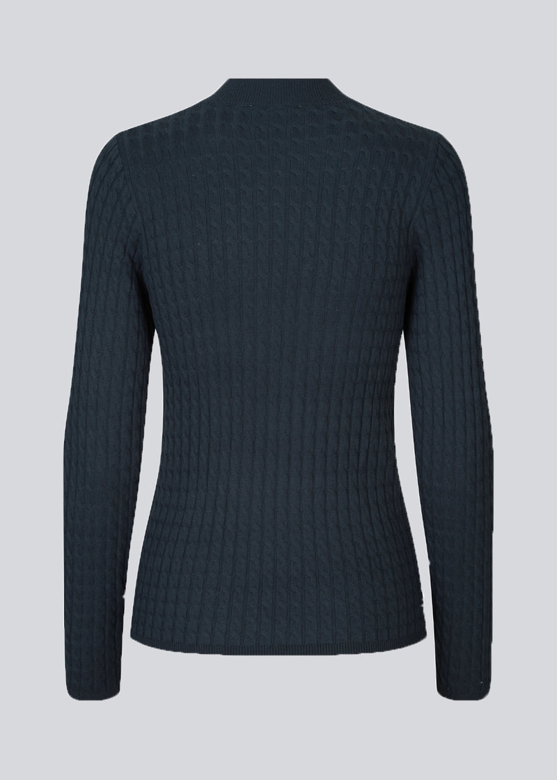 Cable-knitted jumper in dark blue with a figure-hugging silhouette. BimoMD t-neck has a low collar, long sleeves, and ribknitted trimmings.