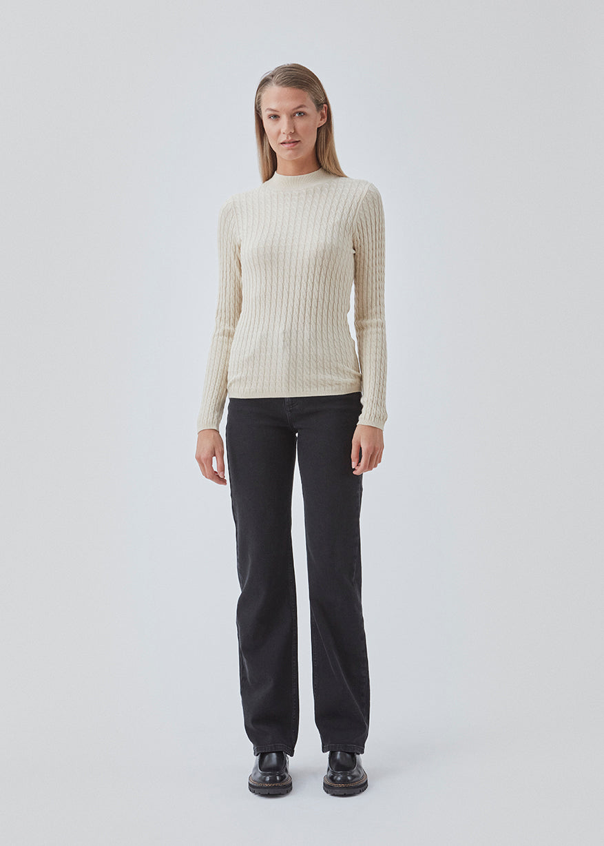 Cable-knitted jumper in beige with a figure-hugging silhouette. BimoMD t-neck has a low collar, long sleeves, and ribknitted trimmings.