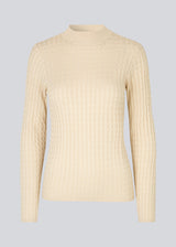 Cable-knitted jumper in beige with a figure-hugging silhouette. BimoMD t-neck has a low collar, long sleeves, and ribknitted trimmings.