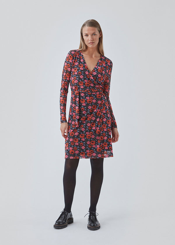 Long sleeved dress with wrap effect. BinnaMD print wrap dress is made of soft mesh with light transparent sleeves and a lined body. The dress has V-neckline and tieband at the waist.