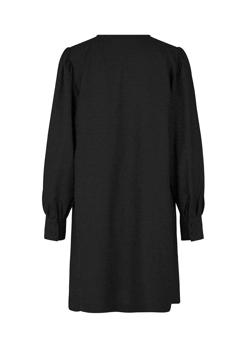 Minidress in black with long volume sleeves and a cuff. BisouMD dress has a v-neckline and an a-shaped silhouette in the body