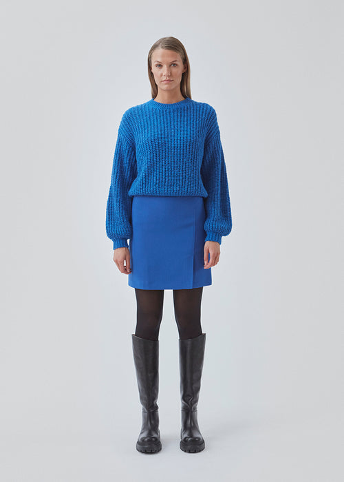 Jumper in blue in soft rib-knit wool and alpaca blend with a metallic thread throughout. BlakelyMD o-neck has a relaxed shape with a round neck, dropped shoulders, and long balloon sleeves.
