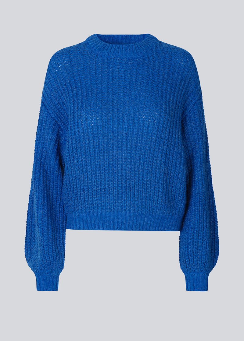 Jumper in blue in soft rib-knit wool and alpaca blend with a metallic thread throughout. BlakelyMD o-neck has a relaxed shape with a round neck, dropped shoulders, and long balloon sleeves.