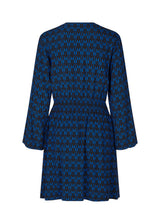 Short printed dress in the color: Graphic Heart Bright Ocean. BorysMD print dress has a v neckline med button closure in the front and smock detail in the waist. The style has long wide sleeves.