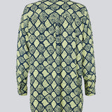 Relaxed, long shirt with a loose-fit silhouette in snake print. CamilaMD print shirt is designed with long sleeves with cuff, collar, and buttons in front. The model is 177 cm and wears a size S/36.