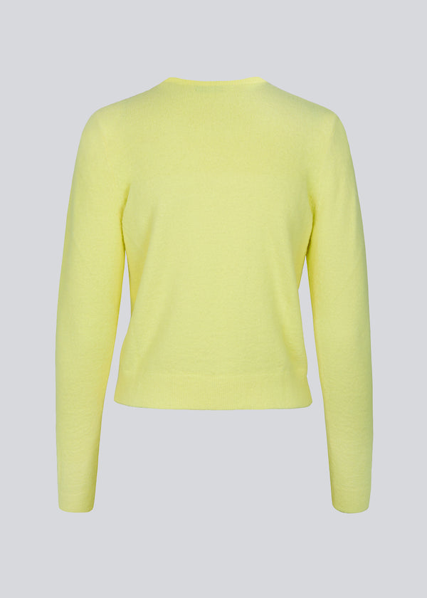 Yellow fine-knit designed with a v-neckline and long sleeves. CammyMD v-neck is a pullover with a more slim fit.