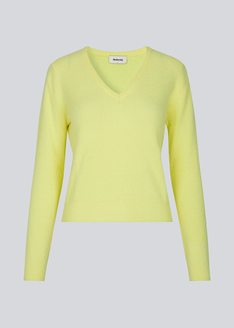 Yellow fine-knit designed with a v-neckline and long sleeves. CammyMD v-neck is a pullover with a more slim fit.