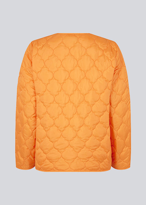 Lightly padded jacket in orange made from recycled nylon with quilted seams. CappelMD jacket has a relaxed shape detailed with a v-neck, long sleeves, and push buttons in front.