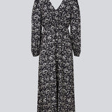 Long dress with elasticated puff sleeves, v-neckline in both front and back, and an elastic detail at the waist. CelineMD print dress is made from an EcoVero viscose with floral print.