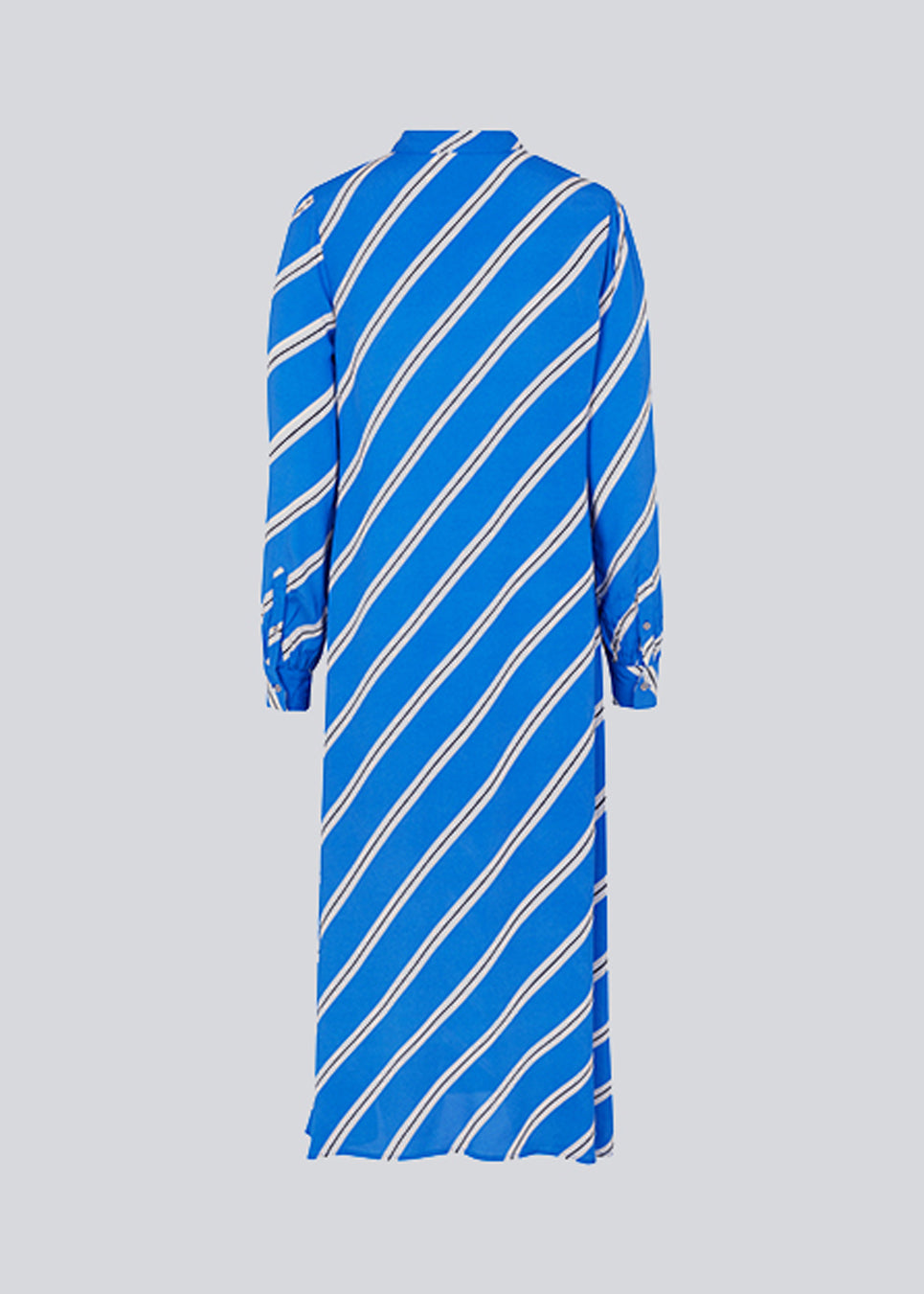 Relaxed long shirt dress with collar, button placket, and long puff sleeves. CenniMD print dress is cut from an EcoVero viscose with diagonal stripes.  The model is 177 cm and wears a size S/36.