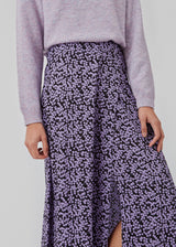 Midi skirt styled with a loose shape and a slit at the side. ChesliMD print skirt has a covered elastic waistband for added comfort.