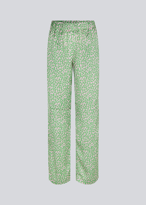 ClarkeMD print pants have straight, wide legs, and a medium waist with covered elasticated. The pants are made from recycled polyester with a smiley print.