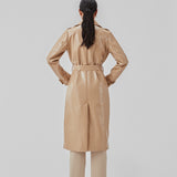 Coat in a shiny material. CollinsMD coat has a classic trenchcoat look with wide collar and lapel, button closure, and belt at the waist.