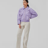 Short, padded bomber jacket in purple. ColtonMD jacket is designed with a collar, zipper in front, and pockets with push buttons. Ribbing at the hem.