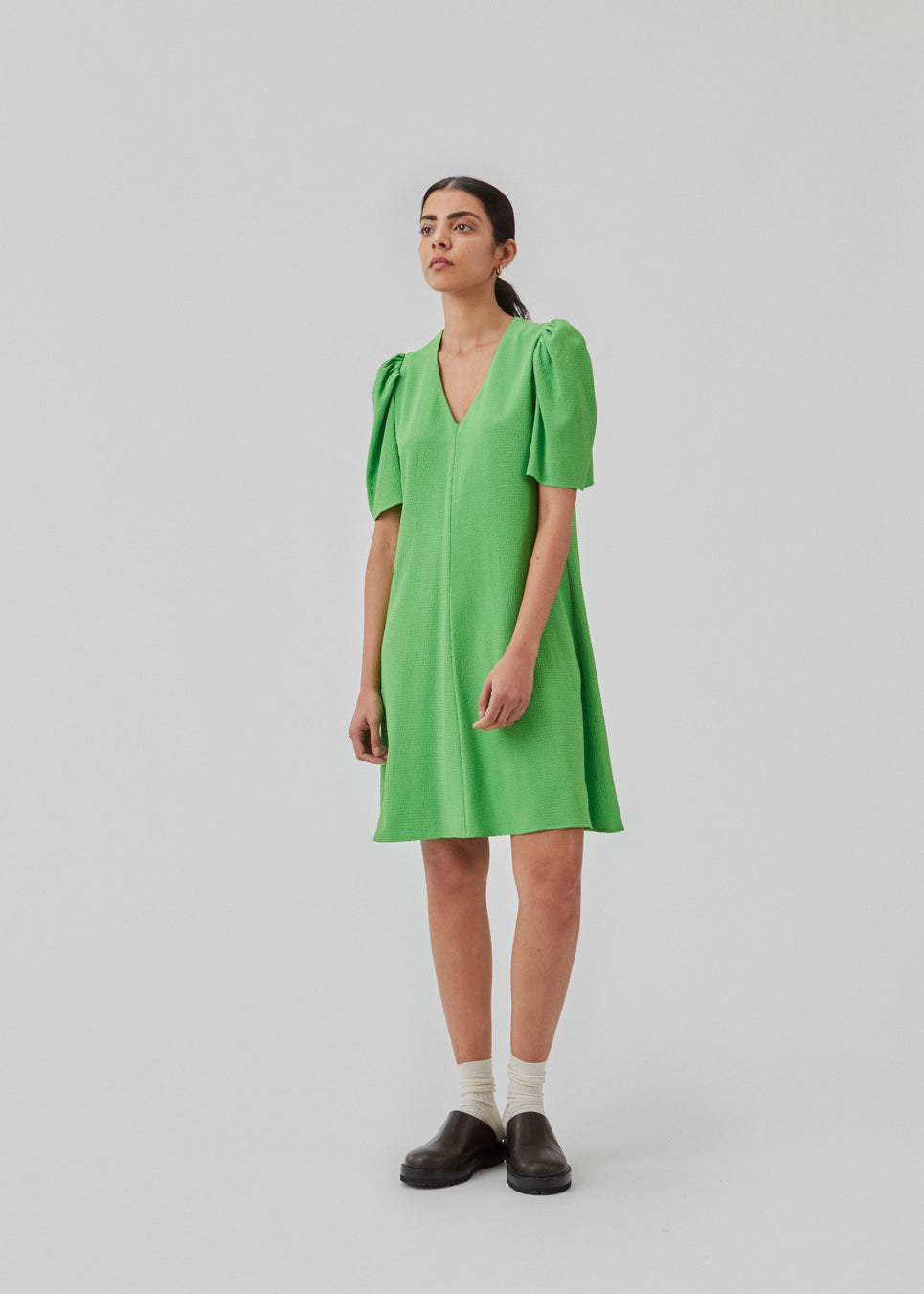 Summer dress with short puff sleeves and v-shaped neckline. CorbaMD dress has a short and full skirt. Lined.