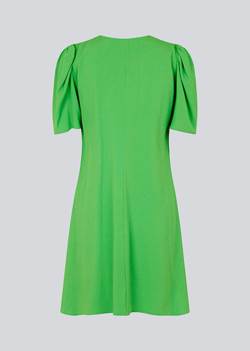 Summer dress with short puff sleeves and v-shaped neckline. CorbaMD dress has a short and full skirt. Lined.