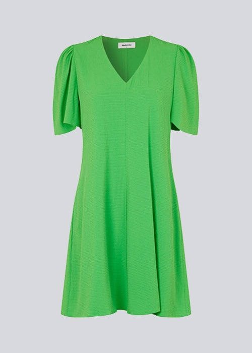 Summer dress with short puff sleeves and v-shaped neckline. CorbaMD dress has a short and full skirt. Lined.