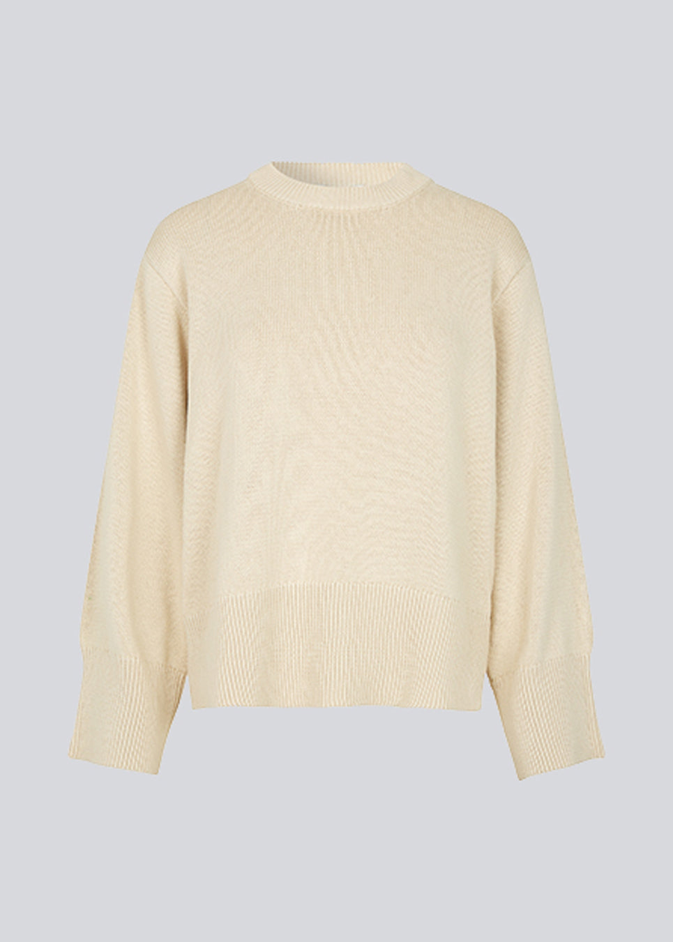 Fine-knitted oversize jumper in beige knitted from cotton. CorbinMD o-neck has ribbed round neckline, long wide sleeves, and wide ribbing at cuffs and hem.