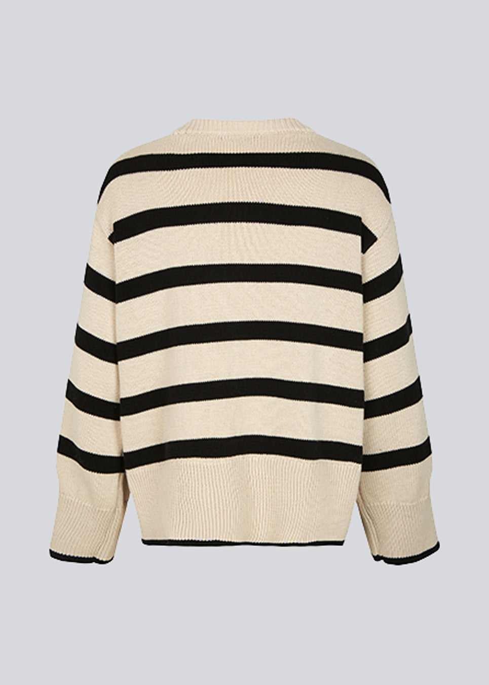 Fine-knitted oversized jumper knitted from cotton with black stripes. CorbinMD stripe o-neck has a ribbed round neckline, long wide sleeves, and wide ribbing at cuffs and hem.