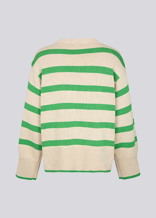 Fine-knitted oversized jumper knitted from cotton with green stripes. CorbinMD stripe o-neck has ribbed round neckline, long wide sleeves, and wide ribbing at cuffs and hem.