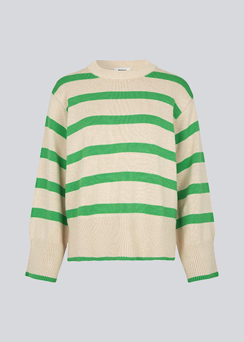 Fine-knitted oversized jumper knitted from cotton with green stripes. CorbinMD stripe o-neck has ribbed round neckline, long wide sleeves, and wide ribbing at cuffs and hem.