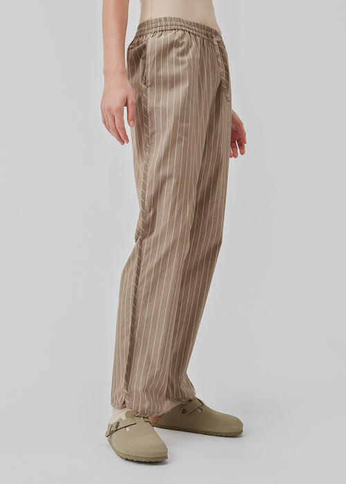 CordeliaMD shirt is made from cotton. Pajama-inspired pants with long, wide legs and a medium waist with elastic and ties. CordeliaMD pants are cut from cotton.  Shop matching shirt for the pants: CordeliaMD shirt.
