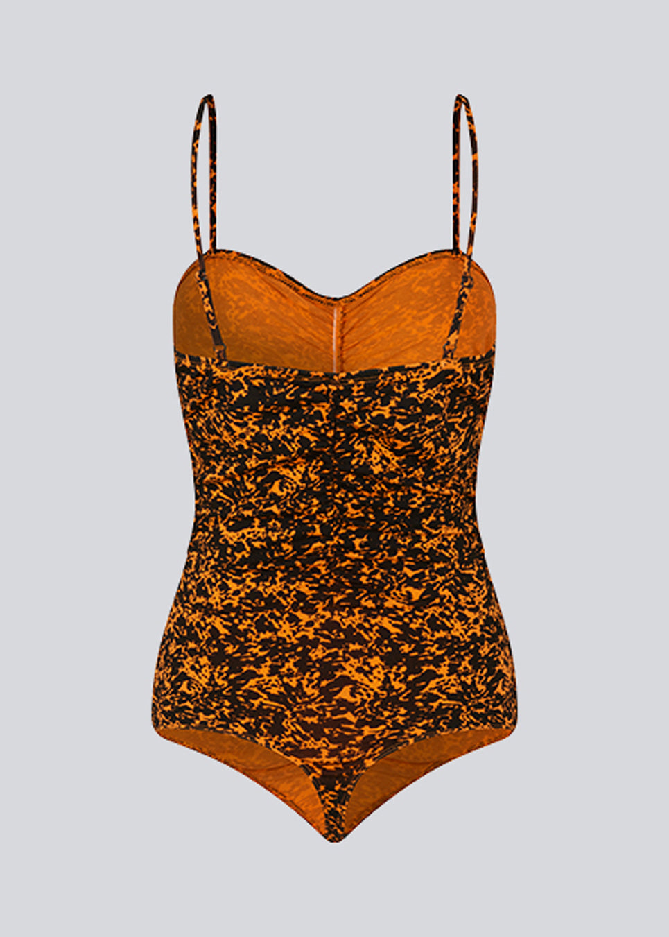 Bodystocking with a tight fit, heart-shaped neckline with a ruched detail, and thin adjustable straps. CurtisMD print bodystocking is designed with a floral print.