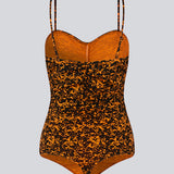 Bodystocking with a tight fit, heart-shaped neckline with a ruched detail, and thin adjustable straps. CurtisMD print bodystocking is designed with a floral print.