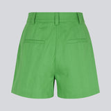 Cotton shorts in green with wide legs. CydneyMD shorts have a tailormade look with pleats in front and paspoil pockets in back. The model is 174 cm and wears a size S/36.