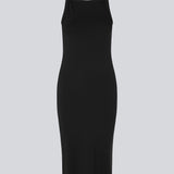 Tight fitted basic black dress in organic cotton jersey. DaeMD dress is sleeveless with a high and straight neckline. The dress cuts below the knees. The model is 177 cm and wears a size S/36.