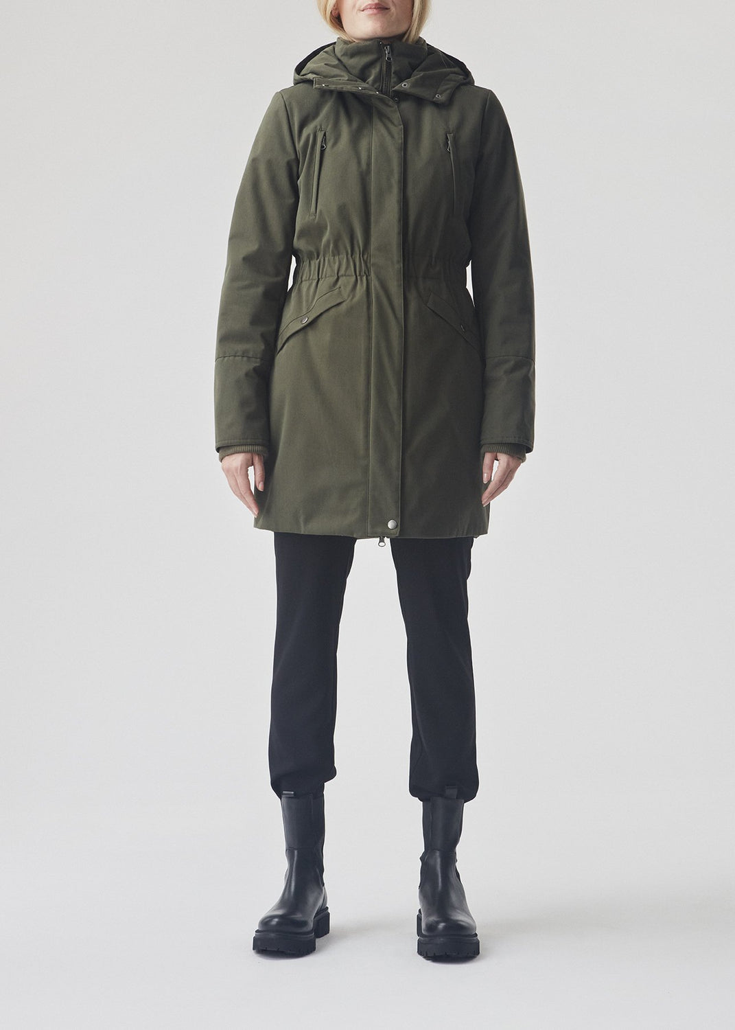 Denise coat in dark green is with hood, fitted at the waist and has hidden zipper closure at front. The jacket has 4 pockets and is lined with Thermolite polyester padding, which is recognized for its high insulation and therefore is the perfect choice for the cold winters.