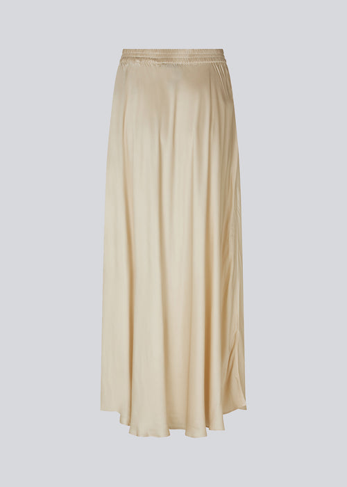 Long white skirt with wide skirt. DevanMD skirt is designed in a shiny satin material with elasticated medium waist.