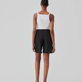 Cargo shorts in black in nylon with wide legs. DilaraMD shorts have an elasticated waistband and two large patch pockets on the sides. The model is 177 cm and wears a size S/36.