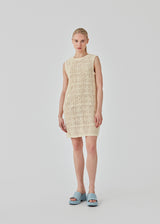  Short dress in a soft cotton blend with a crochet look. DorothyMD dress is sleeveless, has a v-shaped neckline, and wide straps. The model is 177 cm and wears a size S/36.