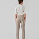 Gale straight pants is a menswear inspired style with straight, slim legs. The design of the pants is kept classic with pressfolds and a high waist. The model is 173 cm and wears a size S/36.   These pants have a spacious fit. We recommend sizing down.  Buy Gale Blazer in the same color that fits the pants.