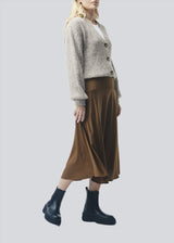 Soft, beige short cardigan in wool mix. Goldie cardigan has structure and button closure.