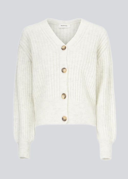 Soft, white short cardigan in wool mix. Goldie cardigan has structure and button closure.