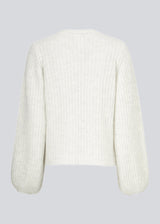 Simple white rib knit with a slim silhouette, voluminous balloon sleeves and a round neckline. The trim on the sleeves and neckline is knitted in a smaller rib. Goldie o-neck is made from an alpaca blend that adds a luxurious feel and look.