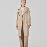 Beautiful jacket with a classic look and wide revers, belted waist and button closure. Hiro jacket is one of our most popular styles and the perfect transition jacket. This jacket has a spacious fit. We recommend sizing down. The model is 174 cm and wears a size S/36